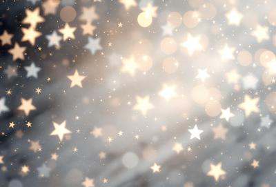 The primary subject of the image is a bright, colorful display of stars. The setting is a dark background, which contrasts with the brightness of the stars. The visual style is a combination of a photo and digital art, creating a unique and eye-catching effect. The colors and mood of the image are predominantly warm and inviting, with the stars creating a sense of wonder and excitement.