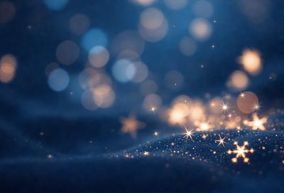 The primary subject of the image is a blue background with a pattern of bright, shining stars. The setting appears to be a night sky, with the stars creating a sense of depth and dimension. The visual style of the image is a combination of a photo and digital art, as the stars are depicted in a way that resembles a painting or drawing. The colors and mood of the image are predominantly blue and serene, with the stars adding a touch of warmth and sparkle.