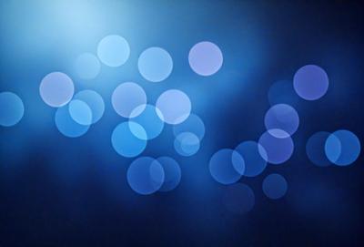 The primary subject of the image is a blue background with a pattern of white circles. The setting appears to be a dark room, and the visual style is a digital art or illustration. The dominant colors are blue and white, creating a calm and serene atmosphere.