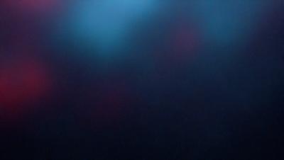 The primary subject of the image is a blue background with a purple hue. The setting appears to be a dark room, possibly a theater or a concert venue. The visual style of the image is a combination of a photo and a digital art, creating a unique and artistic atmosphere. The dominant colors in the image are blue and purple, which contribute to a calm and serene mood.