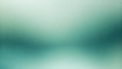 The primary subject of the image is a green background with a blurry, out-of-focus appearance. The setting is a large, open space with a hazy, foggy atmosphere. The visual style is a combination of a photo and a digital art, creating a unique and artistic representation of the scene. The colors and mood are predominantly green, with a slightly moody and atmospheric feel.