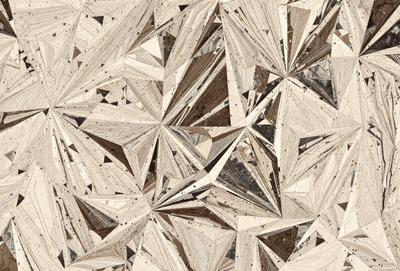 The image features a patterned surface with a combination of wood and stone elements. The primary subject is a close-up of the pattern, which appears to be a mix of wood and stone. The setting is a room with a wooden floor, and the visual style is a blend of natural materials and textures. The colors and mood of the image are warm and earthy, with a focus on the natural elements present in the pattern.