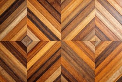 The image features a wooden floor with a pattern of wood planks. The floor is made up of several wooden squares, creating a visually appealing and textured surface. The overall atmosphere of the image is warm and inviting, with the natural wood tones and patterns creating a sense of comfort and coziness.