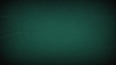 The primary subject of the image is a green table cloth. The setting is a table with a green cloth covering it. The visual style is a close-up of the table cloth, showcasing its texture and color. The colors and mood of the image are predominantly green, creating a calm and soothing atmosphere.