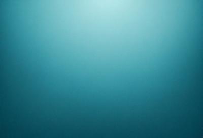 The primary subject of the image is a large, open body of water. The setting is a vast, dark blue ocean with no visible land or objects. The visual style is a realistic representation of the ocean, and the colors and mood convey a sense of vastness and tranquility.