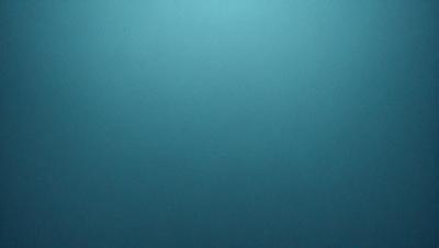 The primary subject of the image is a blue background with a dark blue sky. The setting is a vast, open space with no visible objects or people. The visual style is a simple, clean design with no intricate details or patterns. The colors and mood of the image are calm, serene, and peaceful.