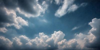 The primary subject of the image is a cloudy sky with a few clouds scattered throughout. The setting is an outdoor environment, possibly during a stormy day. The visual style is a photo, capturing the beauty of the cloudy sky. The colors and mood of the image are predominantly dark and moody, with the clouds creating a dramatic backdrop.