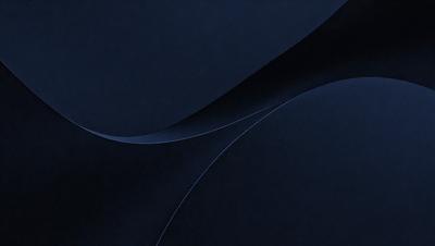 The primary subject of the image is a blue background with a curved design. The setting is a dark blue background, which creates a contrast with the curved design. The visual style is a combination of digital art and illustration, as the curved design appears to be a digital art piece. The colors and mood of the image are predominantly dark blue, creating a calm and serene atmosphere.