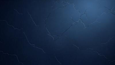 The primary subject of the image is a blue background with a white circle in the center. The circle appears to be a hole or a missing piece, giving the impression of a broken or damaged surface. The visual style of the image is a combination of digital art and illustration, creating a unique and intriguing appearance. The colors and mood of the image are predominantly blue and dark, with the white circle providing a contrasting element.