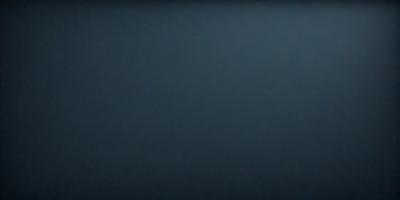 The primary subject of the image is a large, dark blue surface. The setting is a dark blue background, and the visual style is a photo. The colors and mood of the image are predominantly dark and moody, with the blue surface creating a sense of depth and mystery.