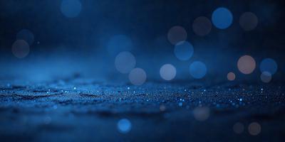 The primary subject of the image is a close-up of a blue surface, possibly a wall or a piece of fabric, with a pattern of blue dots. The setting appears to be a dark room, and the visual style is a close-up of the blue surface. The colors and mood of the image are predominantly blue, creating a calm and serene atmosphere.