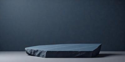The primary subject of the image is a large, rectangular piece of blue fabric. The setting is a blue wall, which serves as the backdrop for the fabric. The visual style is a close-up of the fabric, showcasing its texture and color. The colors and mood of the image are predominantly blue, creating a calm and serene atmosphere.