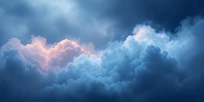 The primary subject of the image is a cloudy sky with a few clouds scattered throughout. The setting is a blue sky, which serves as the backdrop for the clouds. The visual style of the image is a photo, capturing the beauty of the cloudy sky. The colors in the image are predominantly blue and white, creating a calm and serene atmosphere.