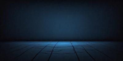 The primary subject of the image is a wooden floor with a blue tint. The setting is a dark room, and the visual style appears to be a photo. The dominant colors are blue and black, creating a moody atmosphere.