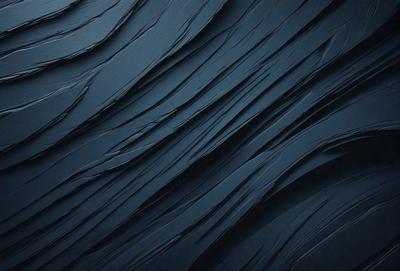 The primary subject of the image is a blue, textured surface that appears to be a wall or a piece of art. The setting is a dark room, and the visual style is a close-up of the blue surface. The colors and mood of the image are predominantly dark and moody, with the blue surface being the main focus.