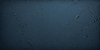The primary subject of the image is a blue background with a textured surface. The setting is a dark room, and the visual style is a close-up of the blue background. The colors and mood of the image are predominantly dark and moody, with the blue background being the main focus.