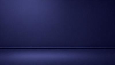 The primary subject of the image is a blue wall. The setting is a dark room, and the visual style is a photo. The dominant colors are blue and purple, creating a calm and serene atmosphere.