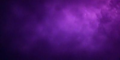 The image features a purple sky with a few stars visible. The sky appears to be cloudy, and the overall atmosphere is somewhat dark and moody. The primary subject of the image is the sky, which is the main focus of the scene.