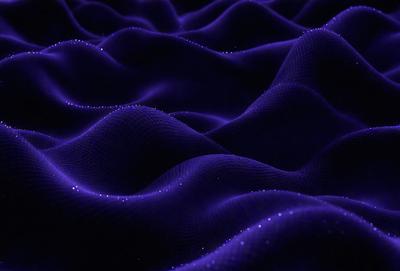 The primary subject of the image is a purple, blue, and white patterned surface. The setting is a dark background, which contrasts with the vibrant colors of the pattern. The visual style appears to be a combination of digital art and illustration, creating a unique and intricate design. The colors and mood of the image are predominantly purple and blue, giving it a calm and serene atmosphere.