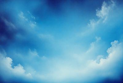 Primary subject: A blue sky with clouds.

Setting/background: The sky is the main focus of the image, with clouds scattered throughout.

Visual style: The image is a photo of the sky.

Colors and mood: The sky is predominantly blue, with the clouds adding a touch of white and gray. The overall atmosphere is serene and peaceful.