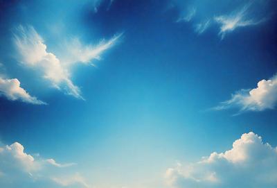 The primary subject of the image is the sky, which is a clear blue with a few clouds scattered throughout. The setting is an open, cloudy sky, and the visual style is a natural, outdoor scene. The colors and mood of the image are serene and peaceful, with the blue sky and clouds creating a calming atmosphere.