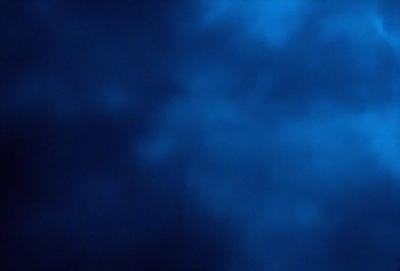The primary subject of the image is a blue sky with clouds. The setting is a cloudy day, and the visual style is a photo. The dominant colors are blue and white, creating a calm and serene atmosphere.