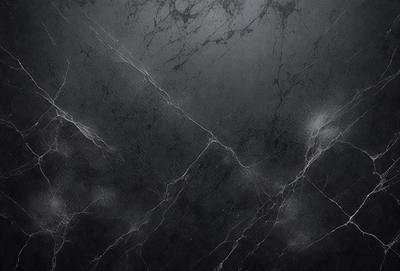 The primary subject of the image is a black marble wall with a pattern of white veins. The setting is a dark room, and the visual style is a close-up of the marble wall. The colors and mood of the image are predominantly dark, with the white veins on the black marble wall providing a contrasting element.