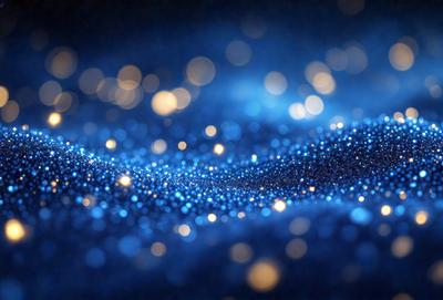 The primary subject of the image is a blue background with a pattern of bright, shining lights. The setting appears to be a dark, starry night, with the blue background providing a contrasting backdrop for the shining lights. The visual style of the image is a combination of a photo and digital art, creating a unique and captivating scene. The colors and mood of the image are predominantly blue, with the shining lights adding a touch of warmth and energy to the overall atmosphere.