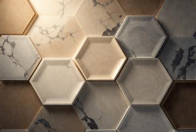 The primary subject of the image is a wall with a pattern of hexagons. The setting is a room with a tiled wall, and the visual style is a photo. The dominant colors are gray and white, creating a clean and modern atmosphere.