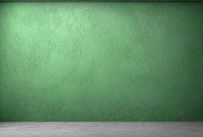 The primary subject of the image is a green wall with a textured surface. The setting is a room with a green wall, and the visual style is a photo. The dominant colors are green, and the overall atmosphere is calm and serene.