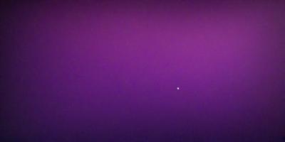 The primary subject of the image is a purple sky with a single star visible in the distance. The setting is a vast, open space with no other objects or elements in the frame. The visual style is a natural, outdoor scene with a focus on the star and the purple sky. The colors and mood of the image are serene and peaceful, with the purple hue creating a calming atmosphere.
