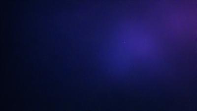 The primary subject of the image is a starry night sky. The setting is a dark, cloudy night with a few stars visible in the sky. The visual style is a photo, capturing the beauty of the night sky. The colors and mood of the image are predominantly dark and moody, with the starlight providing a glimmer of hope and wonder.