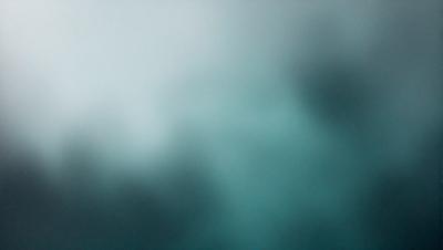 The primary subject of the image is a blue sky with clouds. The setting is a cloudy day, and the visual style is a photo. The colors and mood of the image are predominantly blue, creating a calm and serene atmosphere.