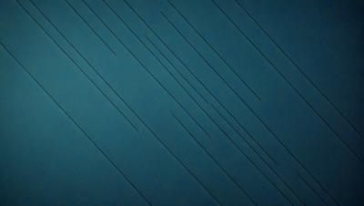 The primary subject of the image is a blue background with a pattern of black lines. The setting appears to be a dark room, and the visual style is a combination of a photo and a digital art. The dominant colors are blue and black, creating a moody atmosphere.