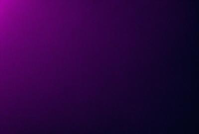 The primary subject of the image is a purple wall. The setting is a dark room, and the visual style appears to be a photo. The dominant colors are purple and black, creating a moody atmosphere.