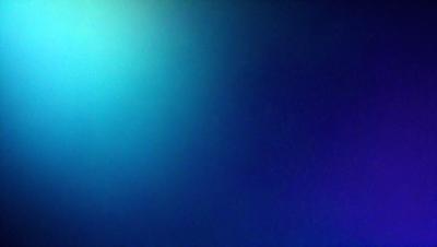 The primary subject of the image is a blue wall with a green hue. The setting is a room with a blue background. The visual style is a photo, and the dominant colors are blue and green. The overall atmosphere is calm and serene.