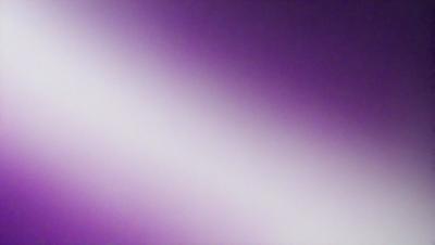 The primary subject of the image is a purple wall. The setting is a room with a purple wall, and the visual style is a photo. The dominant colors in the image are purple, and the overall atmosphere is calm and serene.
