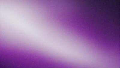 The primary subject of the image is a purple background. The setting is a purple wall, and the visual style is a purple gradient. The colors and mood of the image are predominantly purple, creating a calm and serene atmosphere.
