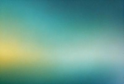 The primary subject of the image is a blue background with a green tint. The setting is a large, open space with a clear sky. The visual style is a combination of a photo and a digital art, creating a unique and artistic representation of the scene. The colors and mood of the image are predominantly blue and green, giving it a calm and serene atmosphere.