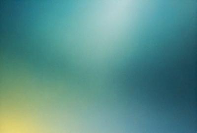 The primary subject of the image is a large, brightly colored, and vibrant green background. The setting is a clear, open sky, which serves as the backdrop for the scene. The visual style of the image is a combination of a photo and digital art, creating a unique and eye-catching appearance. The dominant colors in the image are green and blue, giving it a lively and energetic atmosphere.