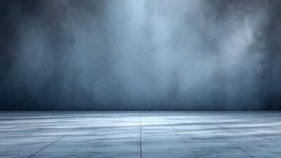 The primary subject of the image is a large, empty room with a blue wall. The setting is a dark, empty space with a blue wall, and the visual style is a photo. The colors and mood of the image are predominantly blue, creating a calm and serene atmosphere.