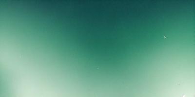 The primary subject of the image is the sky, which is a deep shade of blue. The setting is a vast, open space with no visible landmarks or objects. The visual style is a natural, outdoor scene, and the colors and mood are serene and peaceful.
