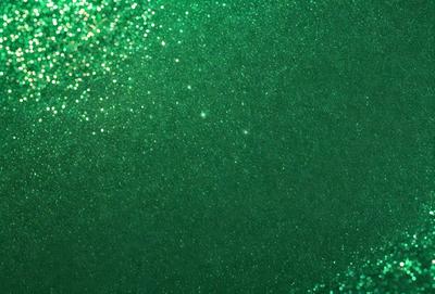 The primary subject of the image is a green background with a pattern of glittering green stars. The setting is a dark room, and the visual style appears to be a digital art or illustration. The dominant colors are green and black, creating a mood of mystery and intrigue.