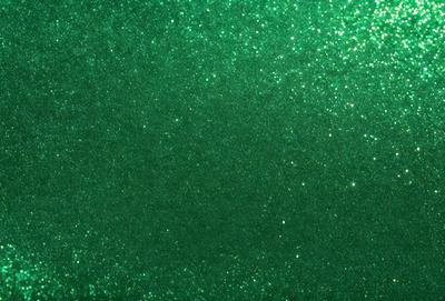 The primary subject of the image is a green background with a glittery texture. The setting is a dark room, and the visual style appears to be a digital art or illustration. The dominant colors are green and black, creating a moody and mysterious atmosphere.