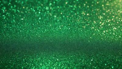 The primary subject of the image is a close-up of a green background with a pattern of glittering green and gold stars. The setting appears to be a dark room, and the visual style is a combination of a photo and digital art. The colors and mood of the image are predominantly green and gold, creating a warm and inviting atmosphere.
