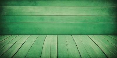 The primary subject of the image is a green wooden wall. The setting is a green wall with a wooden texture, and the visual style is a photo. The dominant colors are green, and the overall atmosphere is calm and serene.