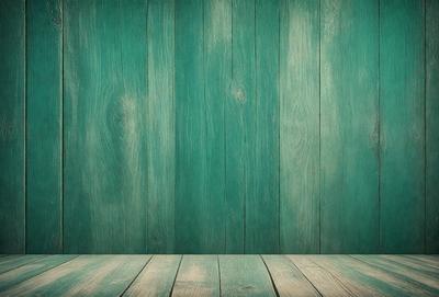 The primary subject of the image is a green wooden wall. The setting is a room with a wooden floor. The visual style is a photo, and the colors and mood are predominantly green, giving the scene a calm and natural atmosphere.