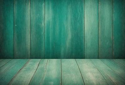 The primary subject of the image is a green wooden wall. The setting is a room with a green wooden floor. The visual style is a photo, and the colors and mood are predominantly green, creating a calm and natural atmosphere.