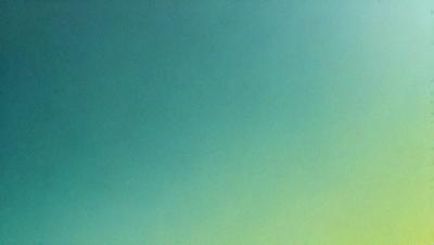 The primary subject of the image is a large, bright green sky. The setting is a vast, open space with no visible landmarks or objects. The visual style is a natural, outdoor scene with a focus on the sky. The colors and mood are vibrant and serene, creating a sense of tranquility and freedom.