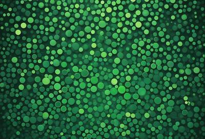 The primary subject of the image is a close-up of a green background with a pattern of green circles. The setting appears to be a wall or a surface with a green hue. The visual style of the image is a close-up of a pattern, which gives it a digital art or illustration appearance. The dominant colors in the image are green, creating a calm and soothing atmosphere.